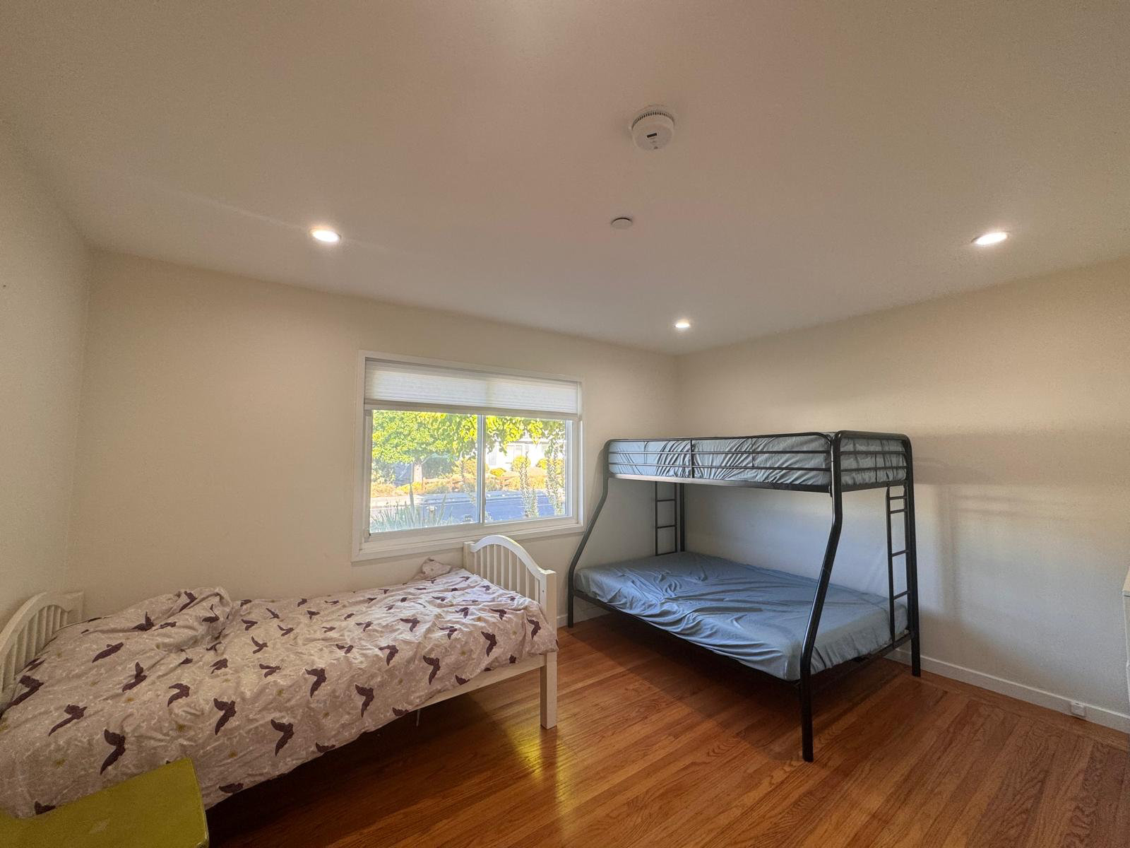 Second bedroom with a twin bed and a twin-over-full bunk bed